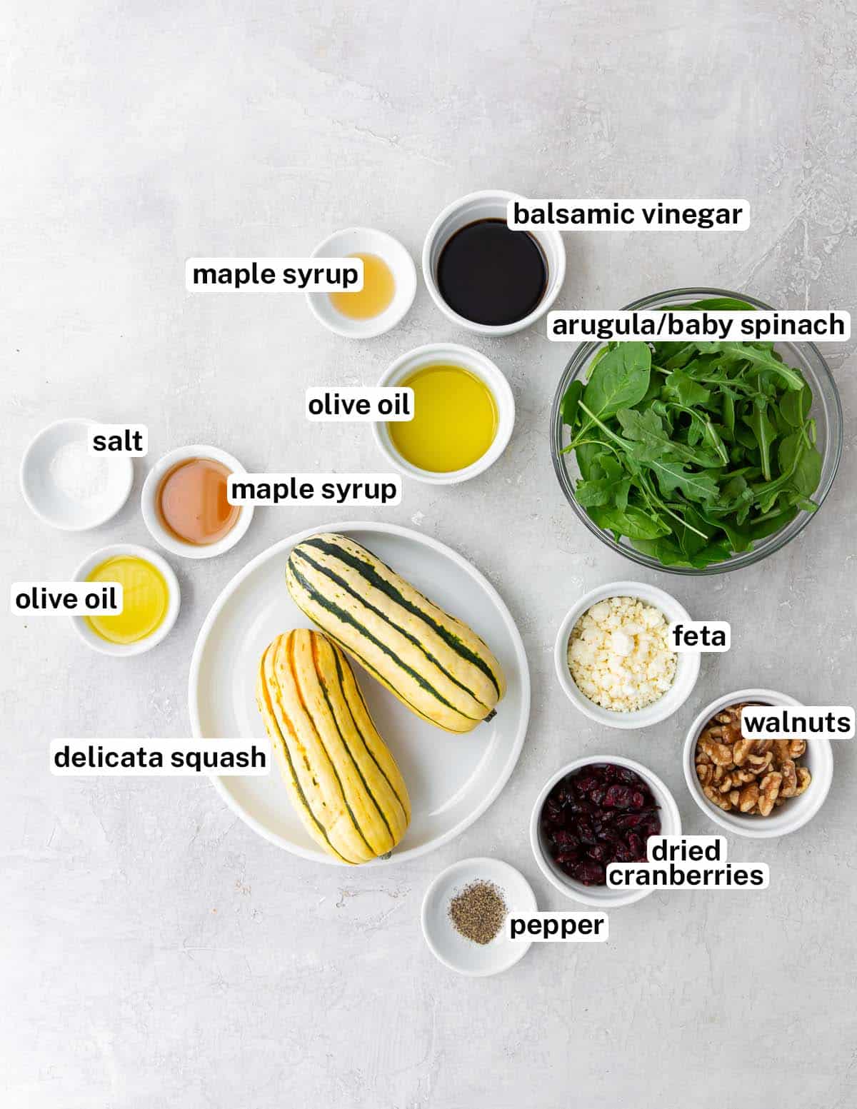 The ingredients to make delicata squash salad with overlay text.