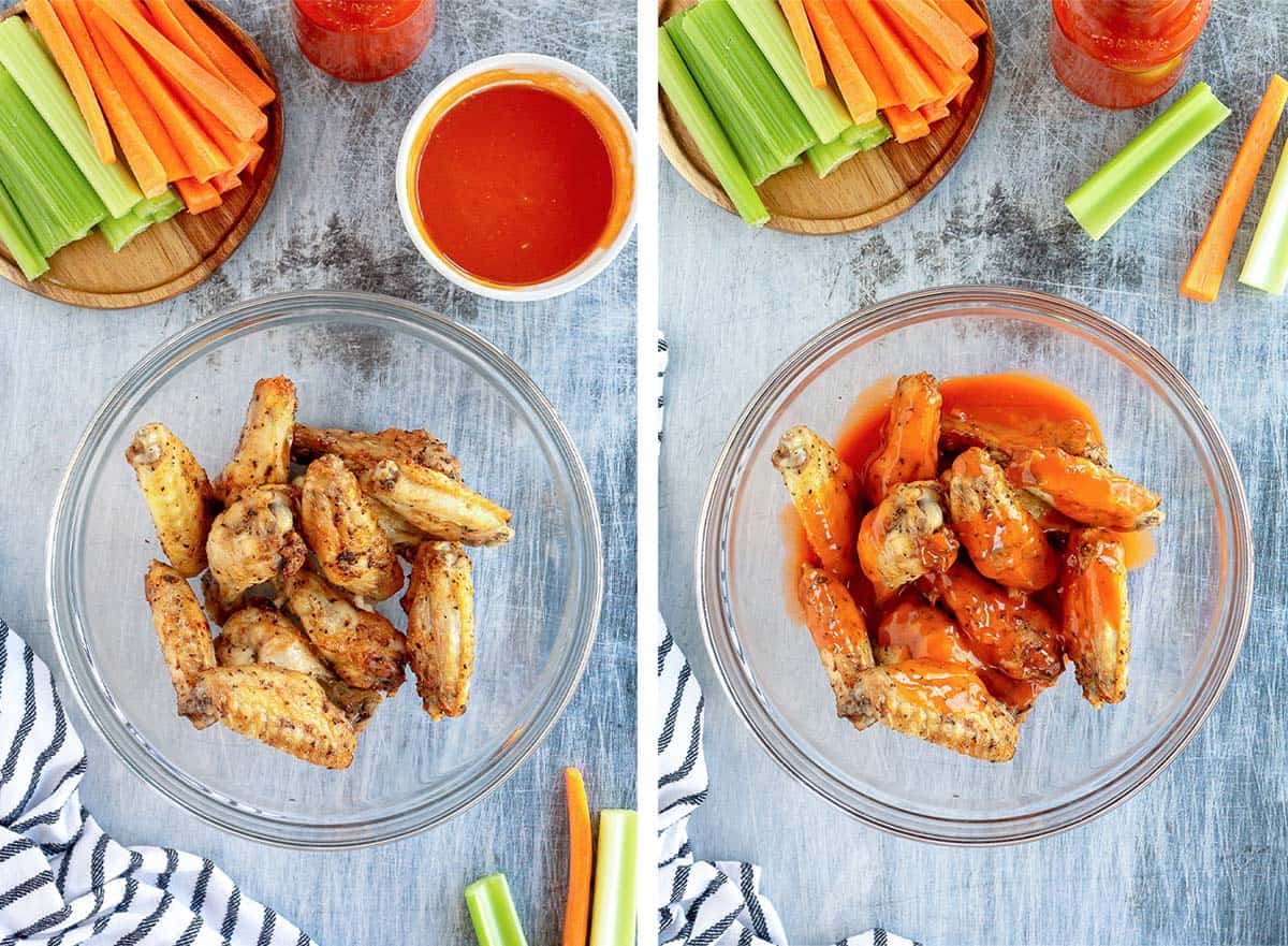Air fried chicken wings are mixed with Buffalo sauce in a bowl.