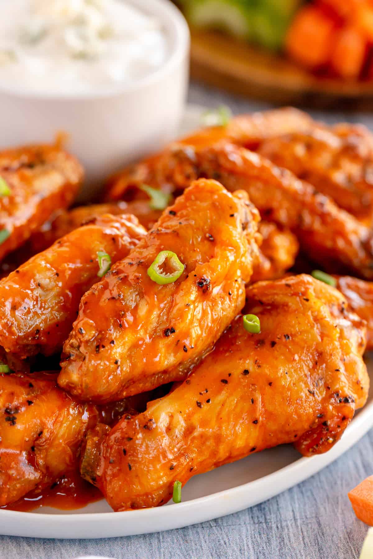 A close up of buffalo chicken wings on a platter.