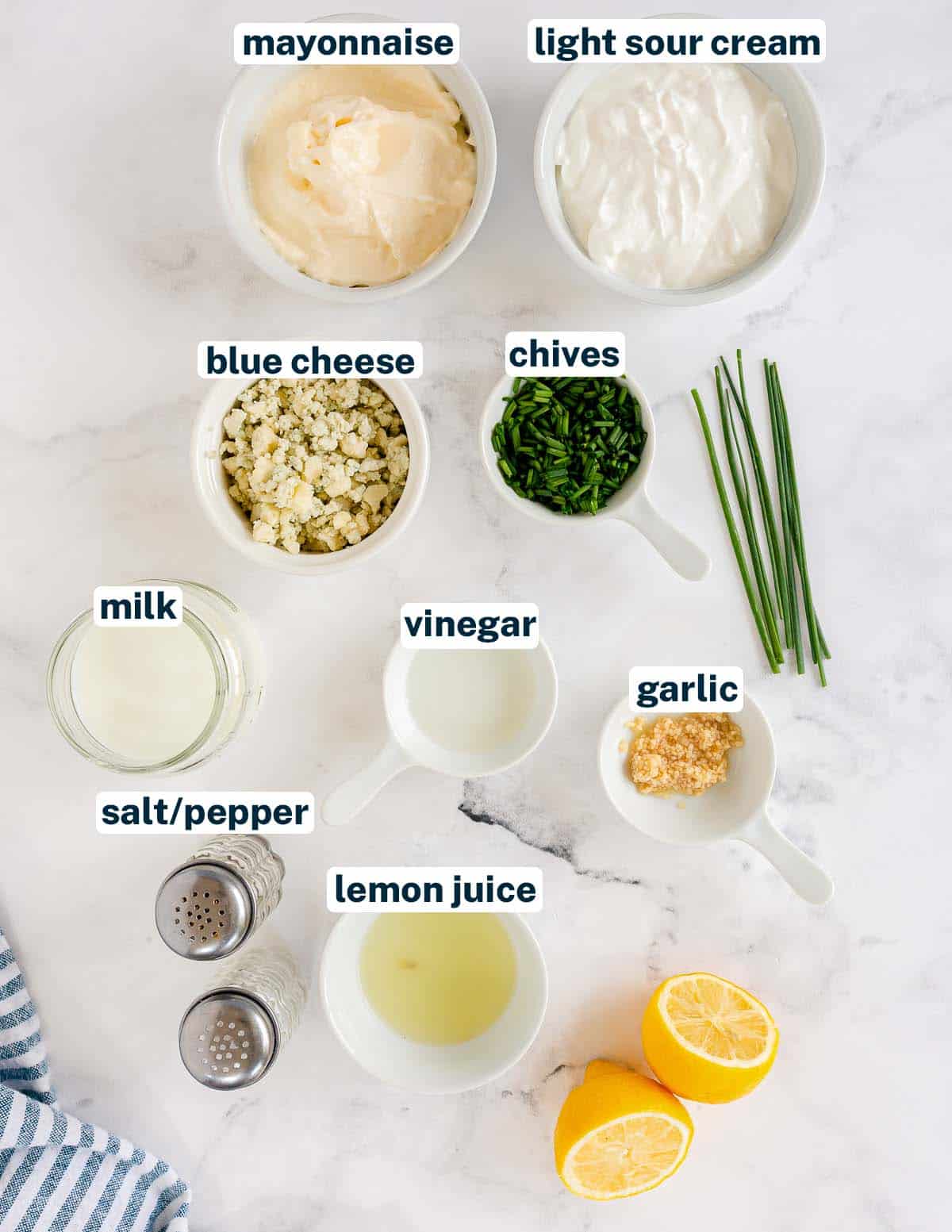 Ingredients for Light Blue Cheese Dressing on a white surface with overlay text.