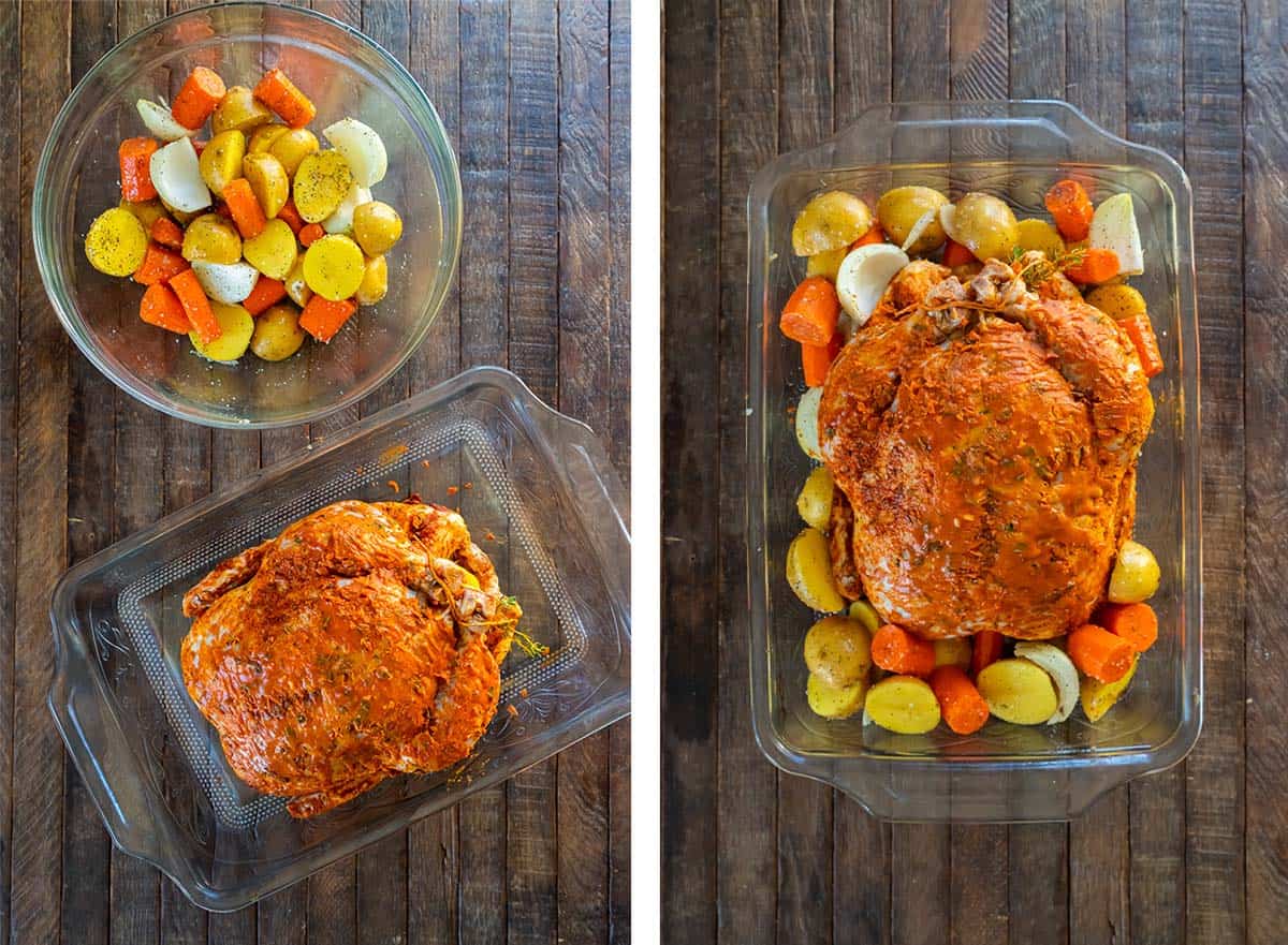 A seasoned chicken in a baking dish with vegetables.