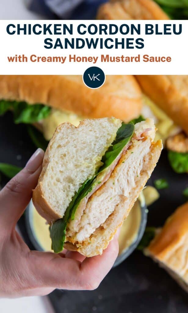 A hand holds a Chicken Cordon Bleu Sandwich with overlay text.