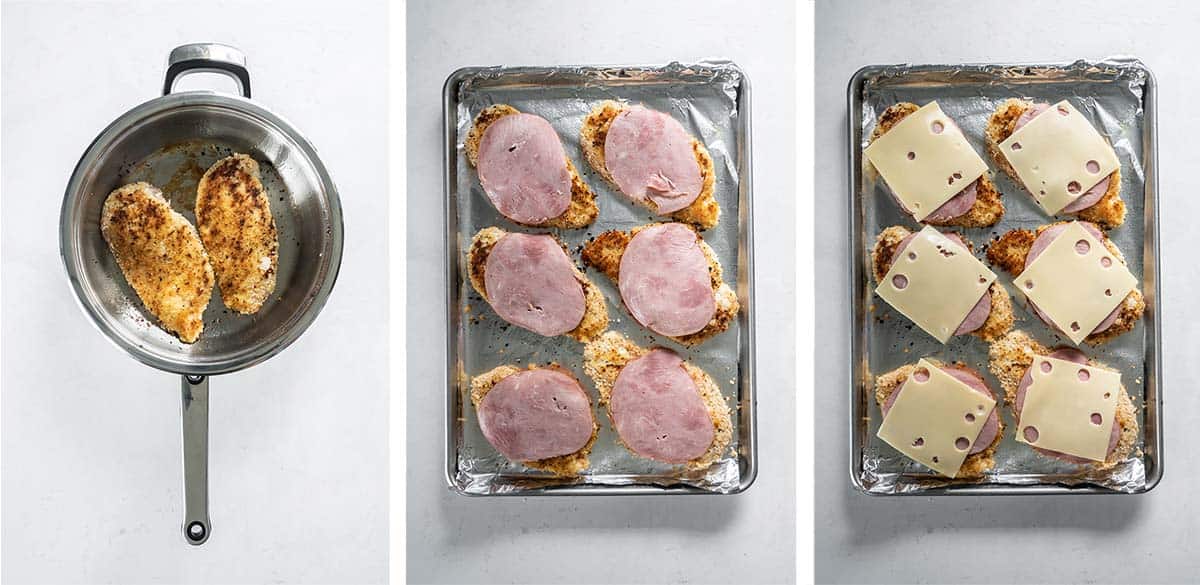 Breaded chicken on a baking sheet is topped with ham and swiss cheese.