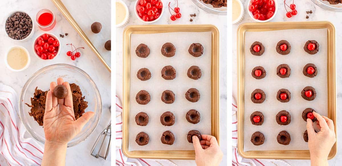 A thumb presses into a ball of chocolate cookie dough and an hand places a maraschino cherry on top.