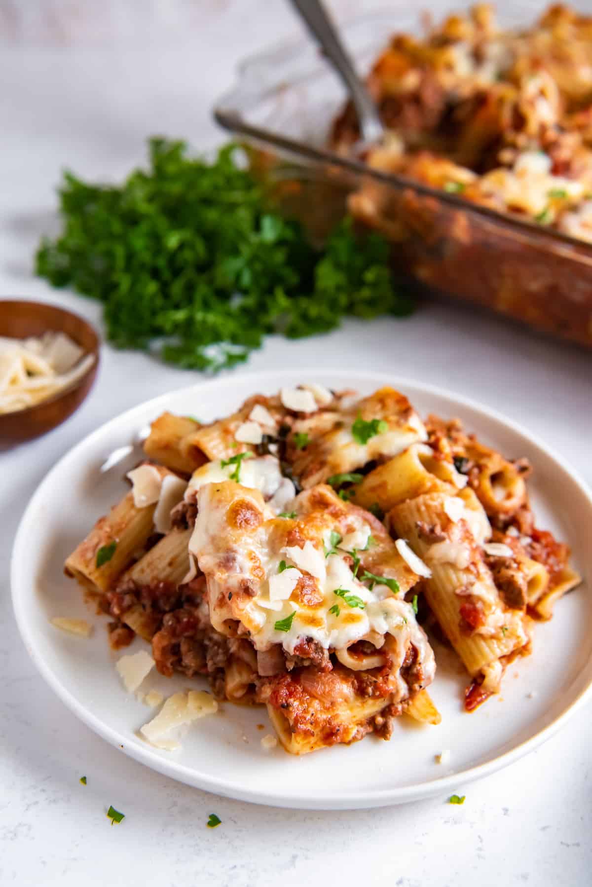 Rigatoni with meat sauce on a white plate.
