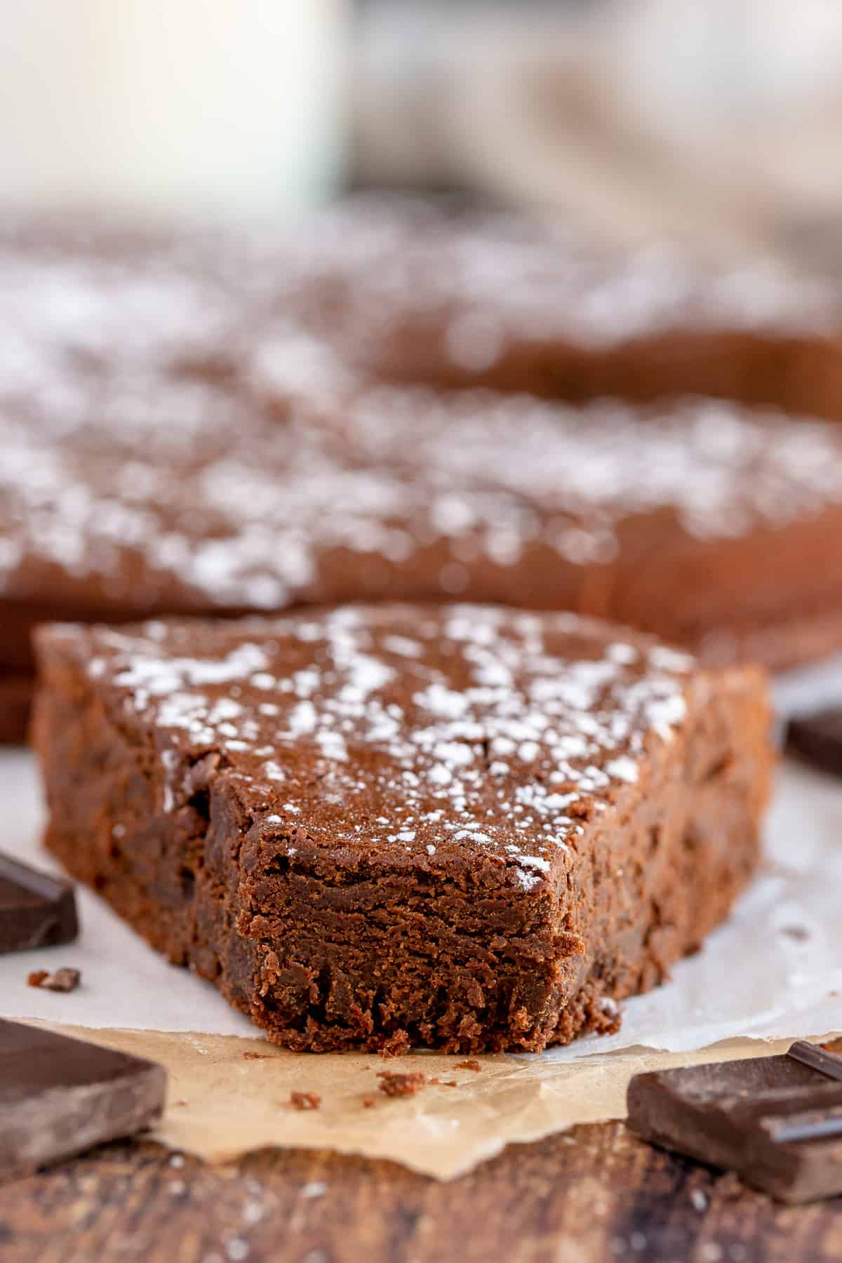 A slice of French Chocolate Cake with a bite missing.
