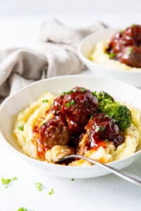 BBQ Meatballs and Mashed Potatoes in a bowl with broccoli.
