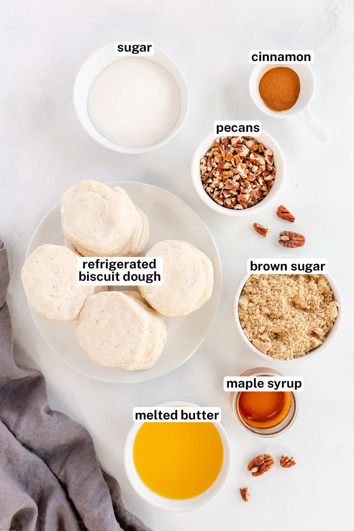 Ingredients for maple pecan monkey bread with text.