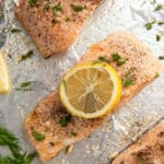 Baked salmon on foil with lemon and dill.