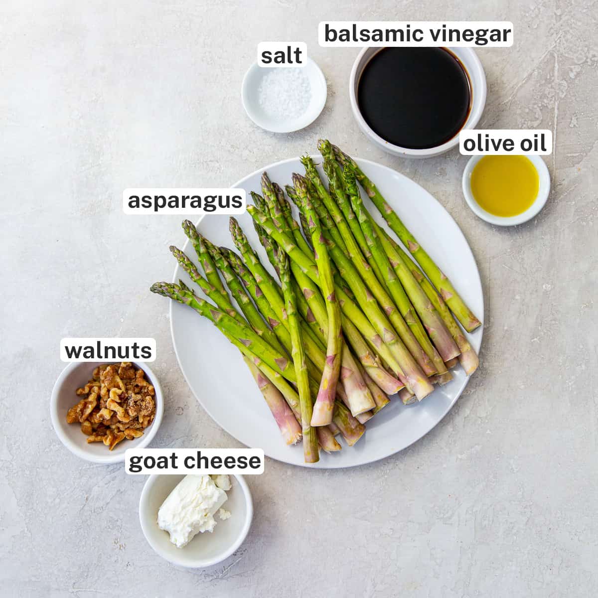 Asparagus, balsamic vinegar, goat cheese and other ingredients with text.
