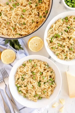 Orzo with Peas and Parmesan in a skillet and two bowls.