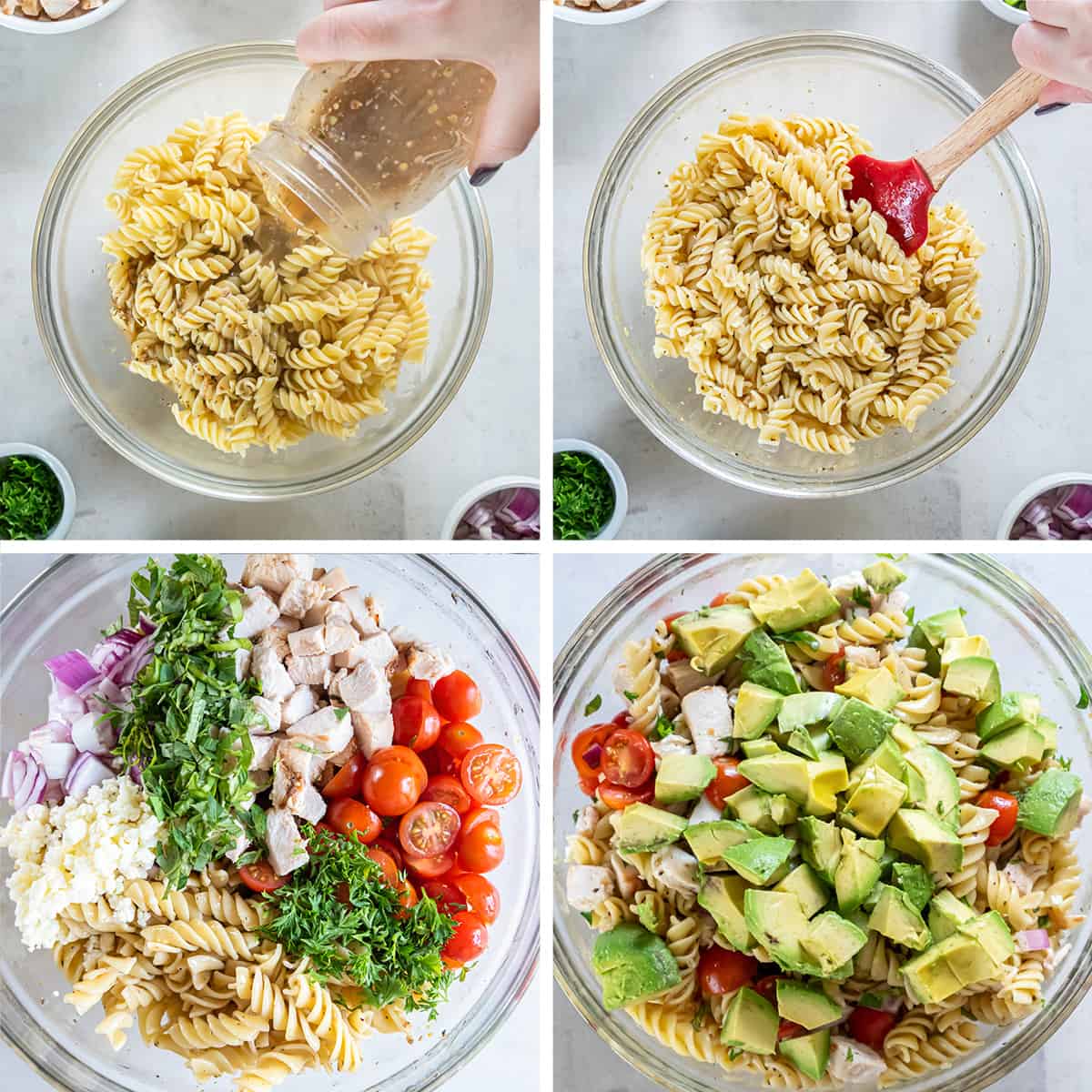 Rotini pasta is combined with chicken, tomatoes, and other ingredients in a bowl and topped with avocado.