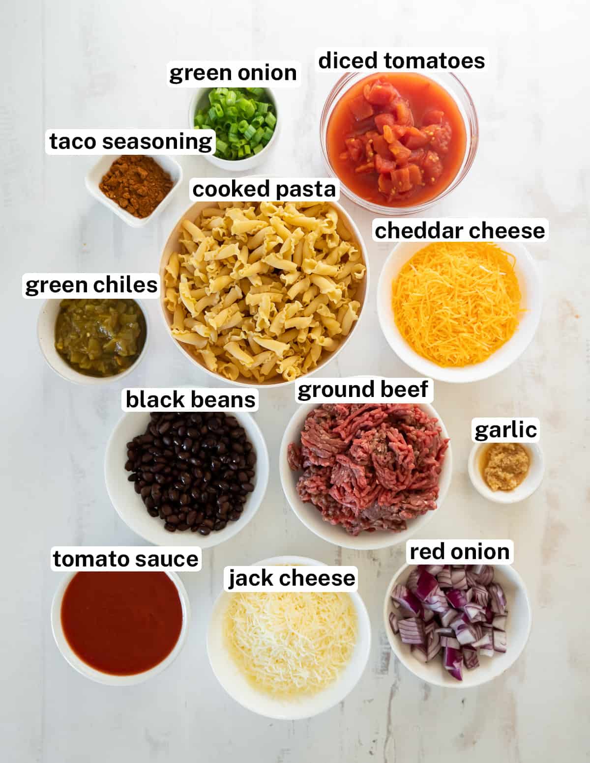 The ingredients for Taco Pasta Bake with text.