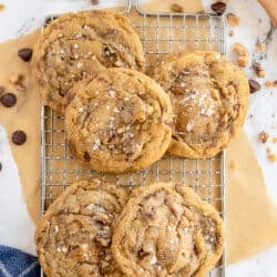 A top down shot of cookies on a wire rack.