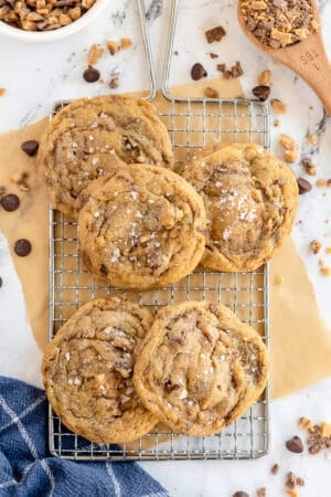 A top down shot of cookies on a wire rack.