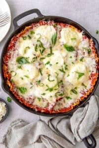 A top down shot of a Skillet Lasagna in a cast iron skillet.