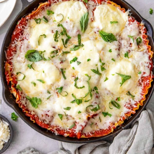 A top down shot of a Skillet Lasagna in a cast iron skillet.