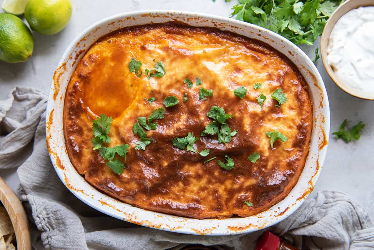 A top down shot of tamale pie in a white casserole dish.