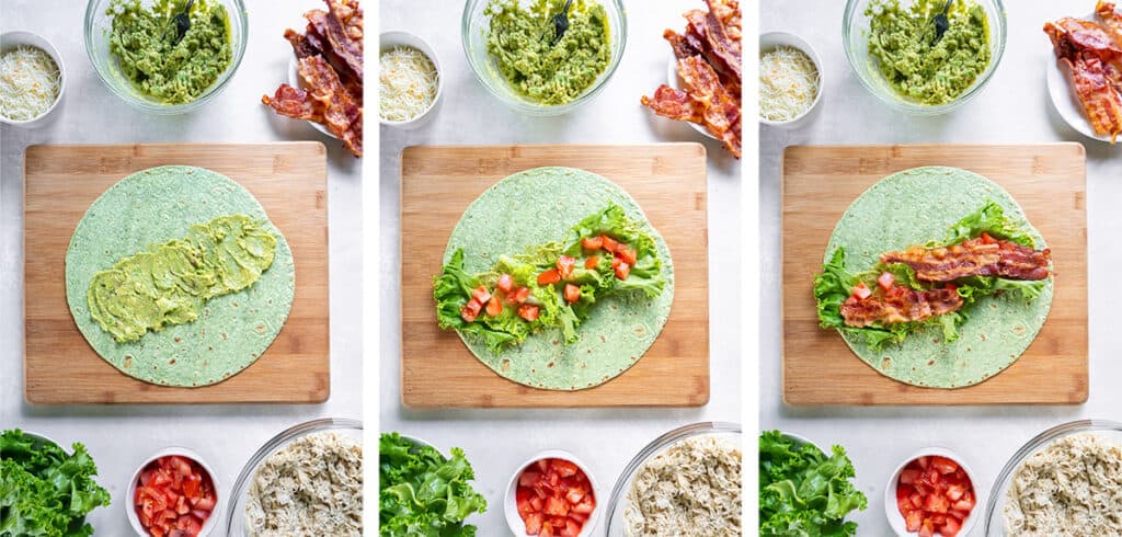 Smashed avocado, lettuce, tomato and bacon are layered on a large green spinach wrap.