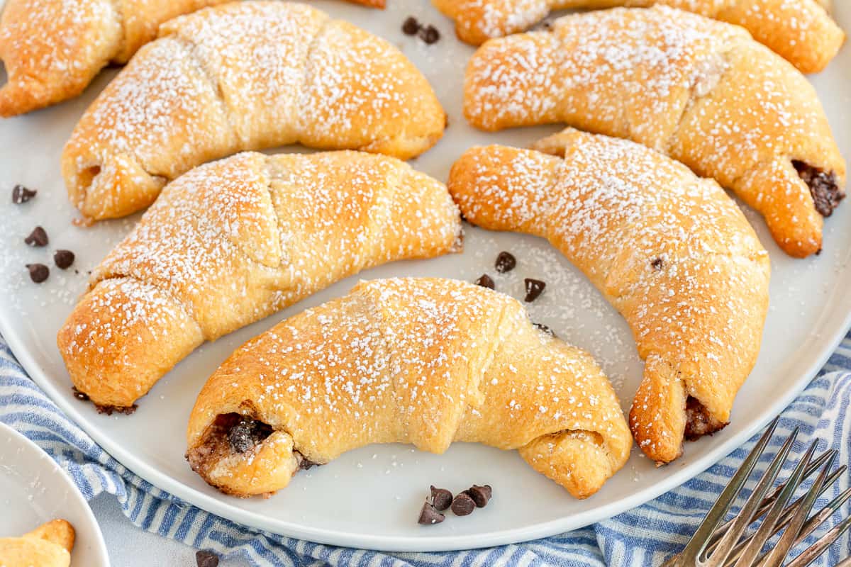 Chocolate Crescent Rolls on a white plate.