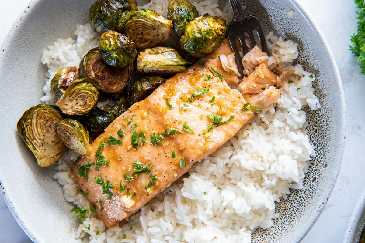 Roasted Salmon in a bowl with rice and brussels sprouts.