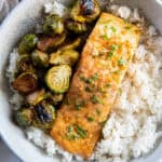 Roasted Salmon in a bowl with rice and brussels sprouts.