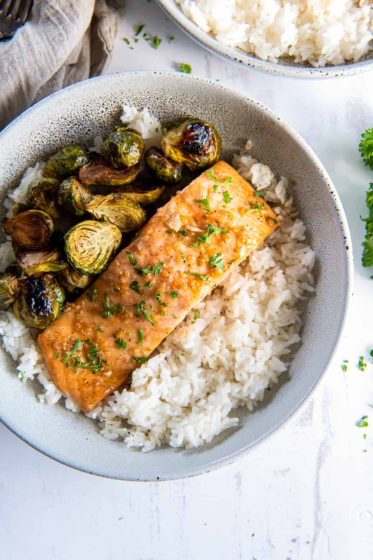 Roasted Salmon in a bowl with rice and brussels sprouts.