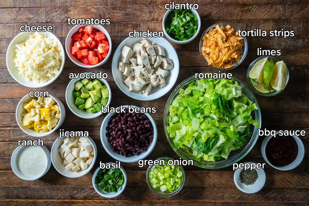 The ingredients for BBQ Chicken Salad in bowls with text.