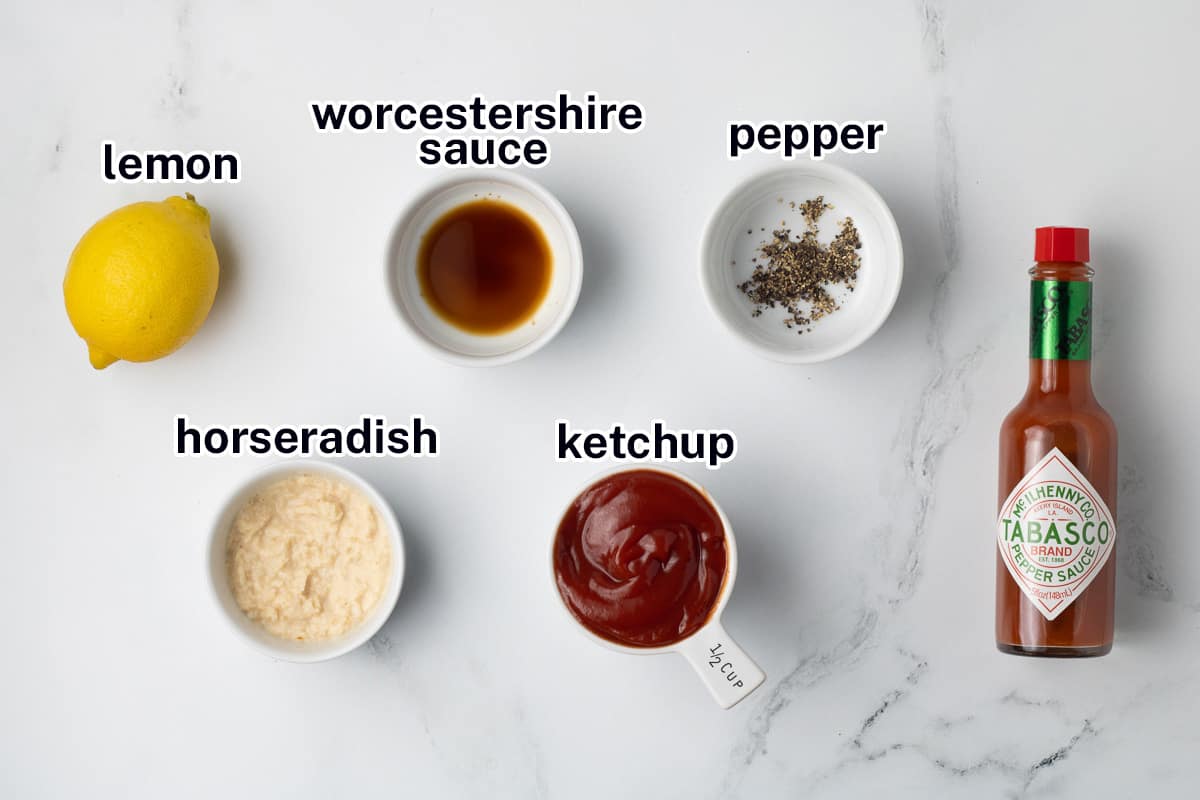 Ketchup, horseradish and other ingredients in small bowls with text.