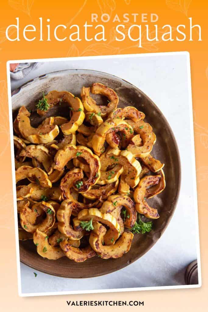 Roasted delicata squash on a white plate with text overlay.