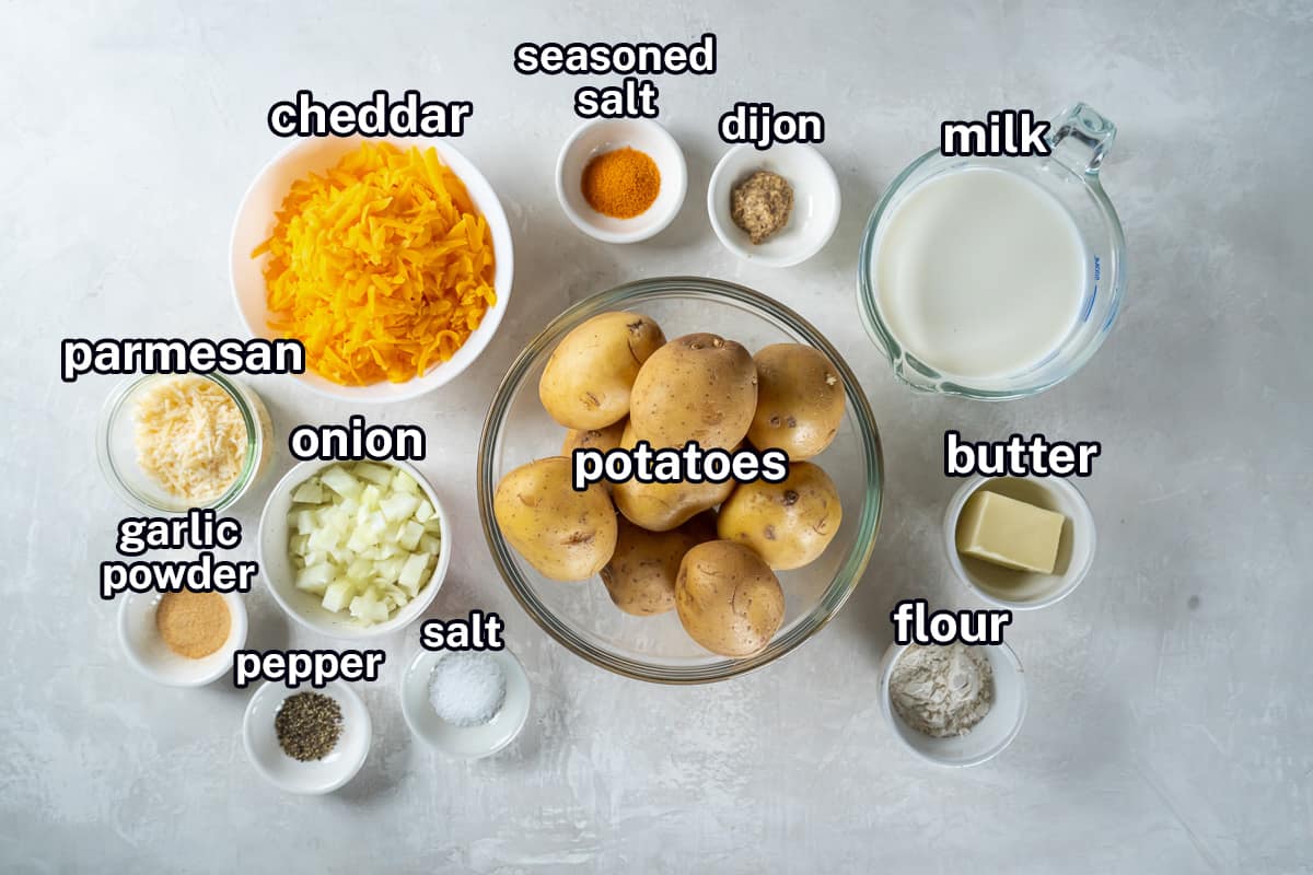 Potatoes, cheese, milk and other ingredients in small bowls with text.