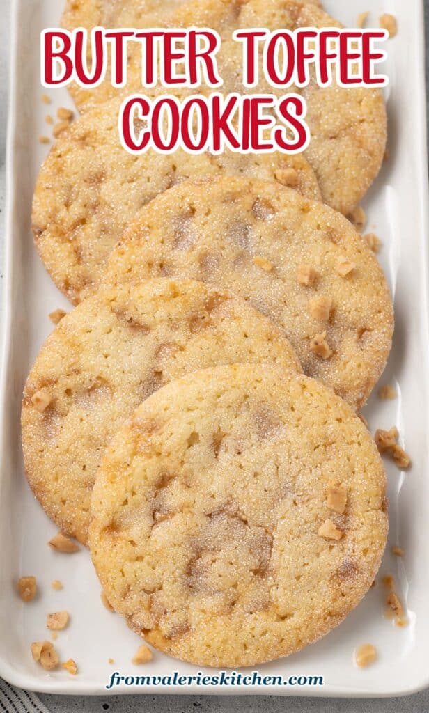 A row of Butter Toffee Cookies on a narrow white platter with text.