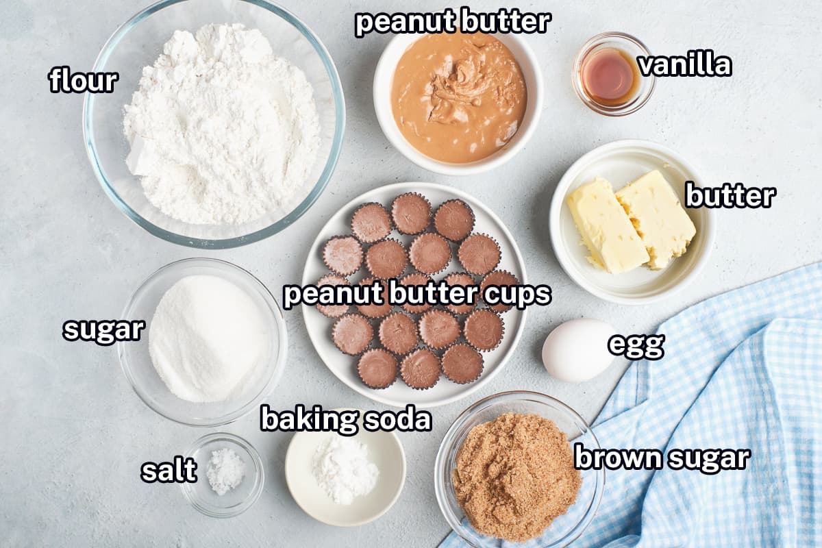 Flour, sugar, peanut butter cups and other ingredients in bowls with text.