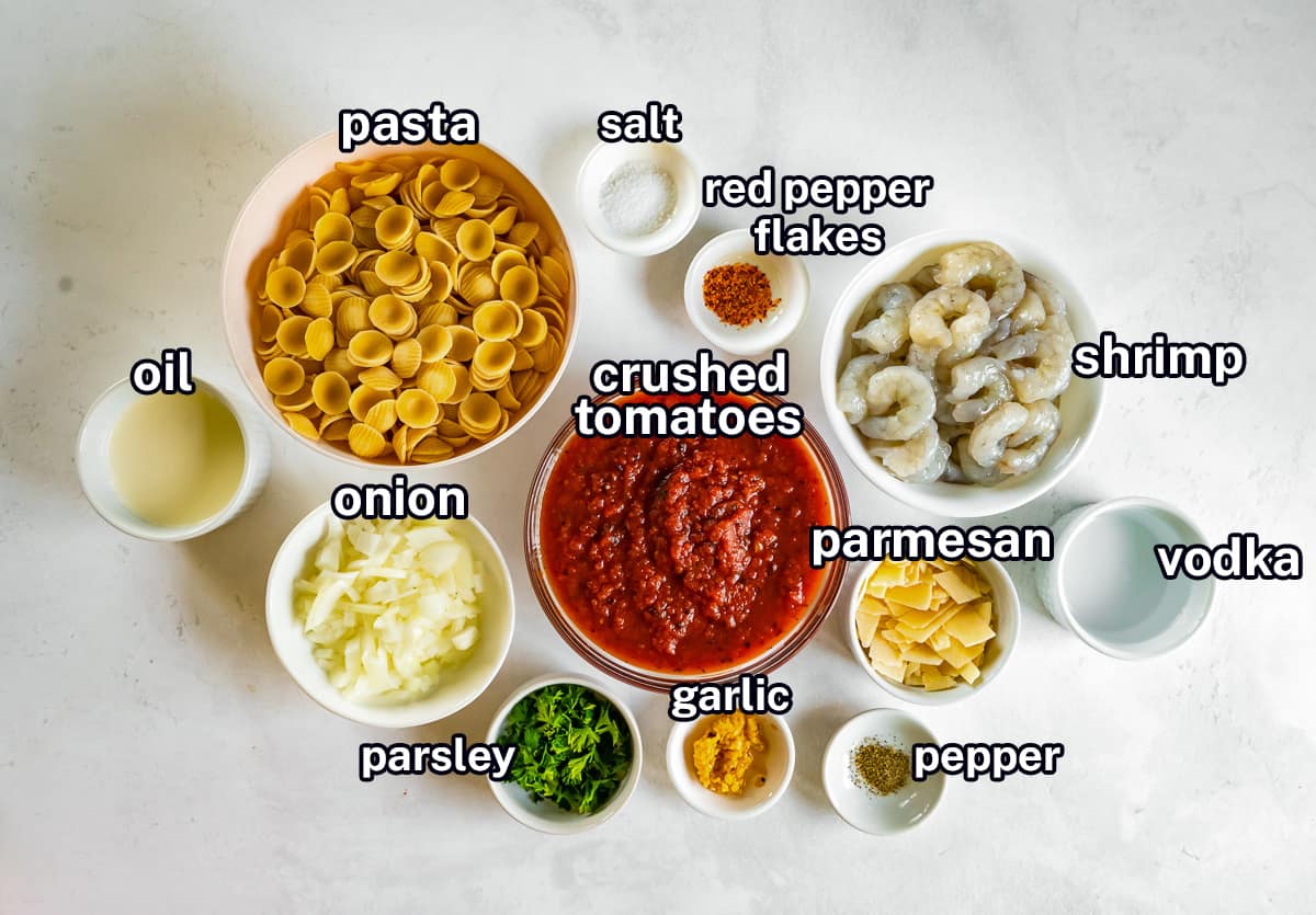Dry pasta, shrimp and other ingredients with text. 