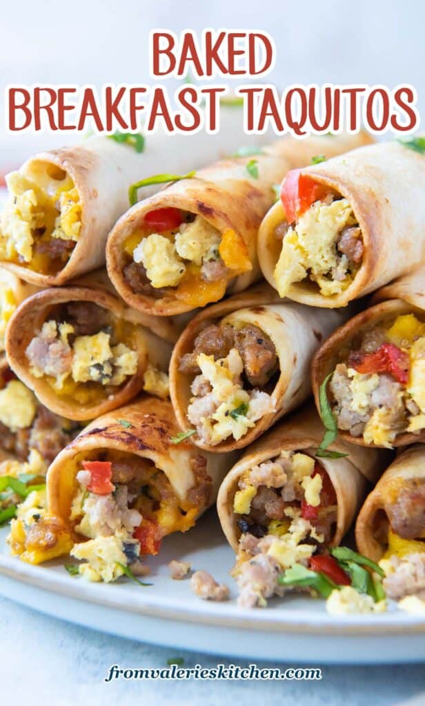 A stack of egg and sausage breakfast taquitos stacked on a white plate with text.