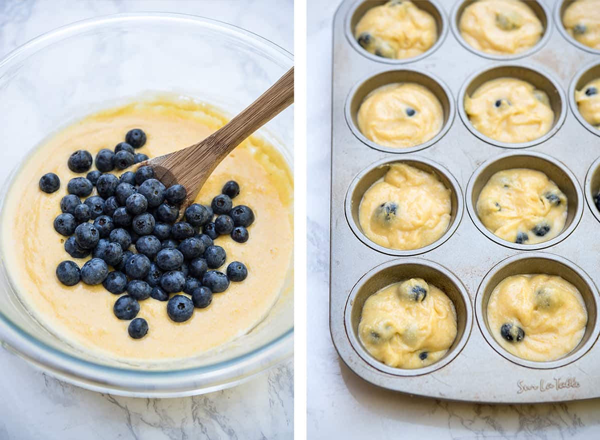 A bowl of muffin batter with fresh blueberries piled on top and blueberry cornmeal muffin batter in a muffin tin.
