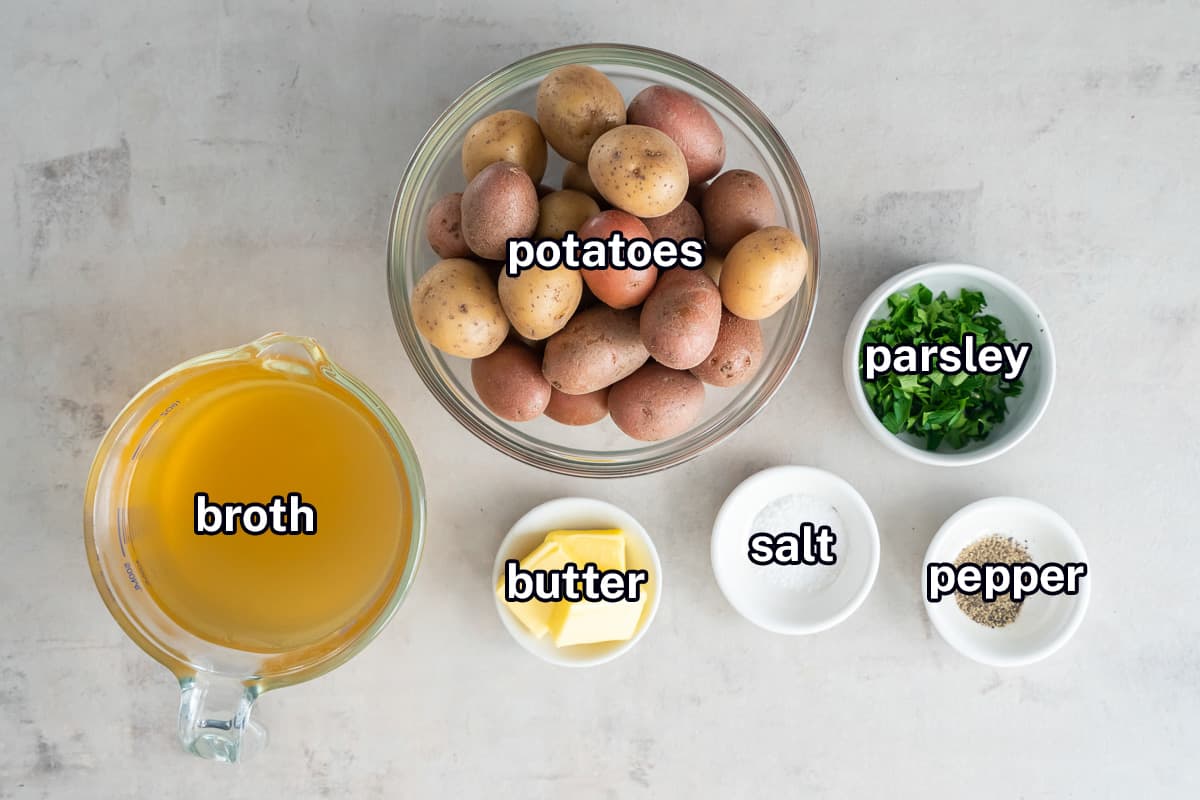 Baby potatoes, chicken broth, parsley, butter, salt and pepper in bowls with text.