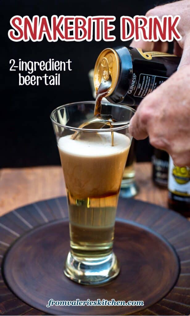 Guinness being poured from a can over a spoon and into a beer glass on top of a hard cider forming layers with text.