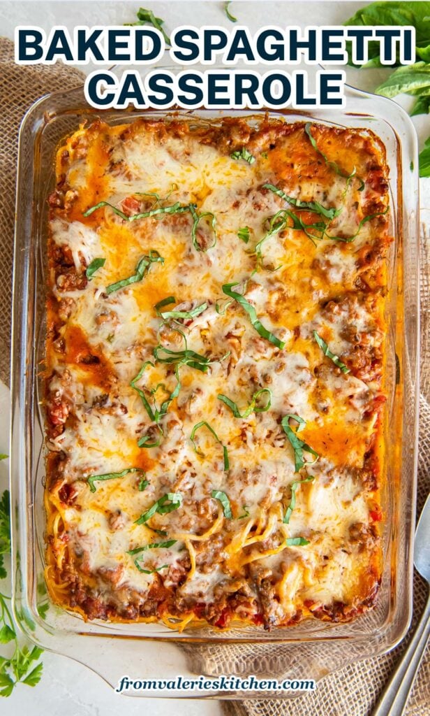 A top down shot of spaghetti casserole in a baking dish with text.