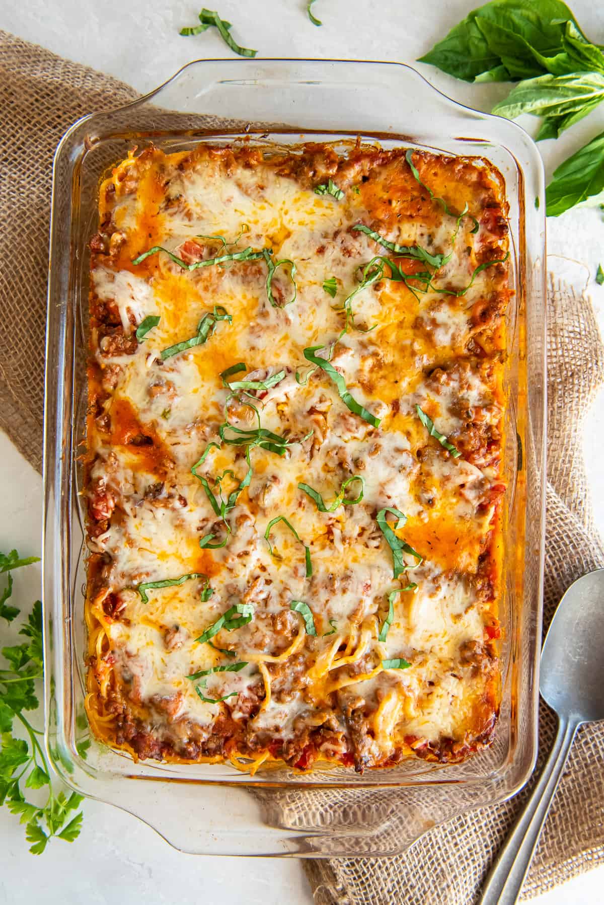 A top down shot of spaghetti casserole in a baking dish.