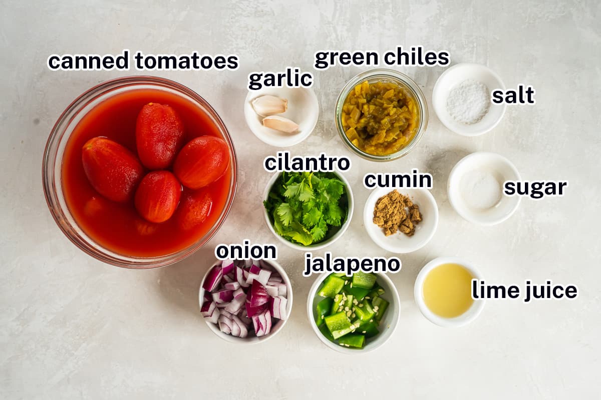 Canned tomatoes, garlic, green chiles, and other ingredients in bowls with text.