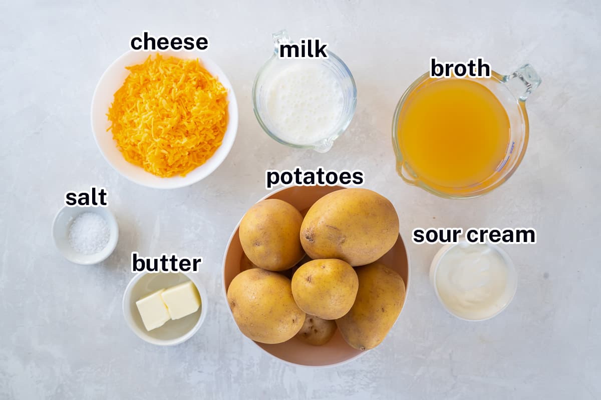 Potatoes, shredded cheese, milk and other ingredients in bowls with text.