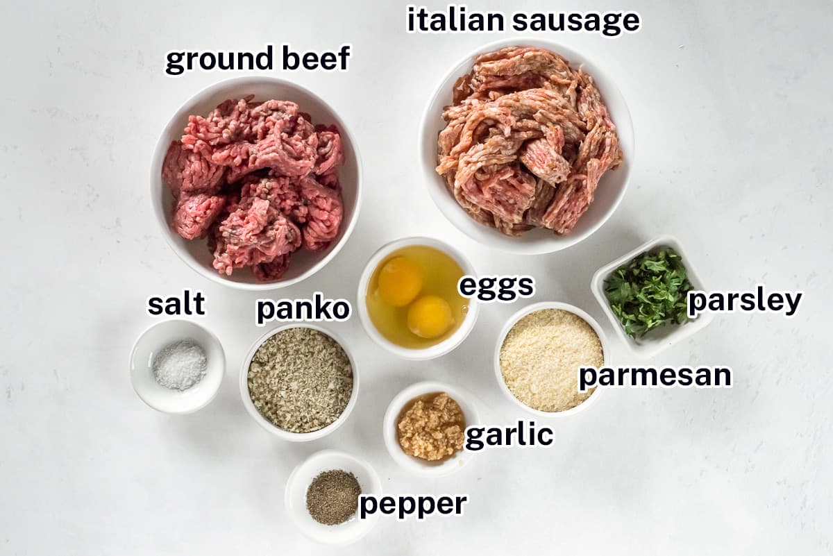 Ground beef, Italian sausage and other ingredients for homemade meatballs with text.