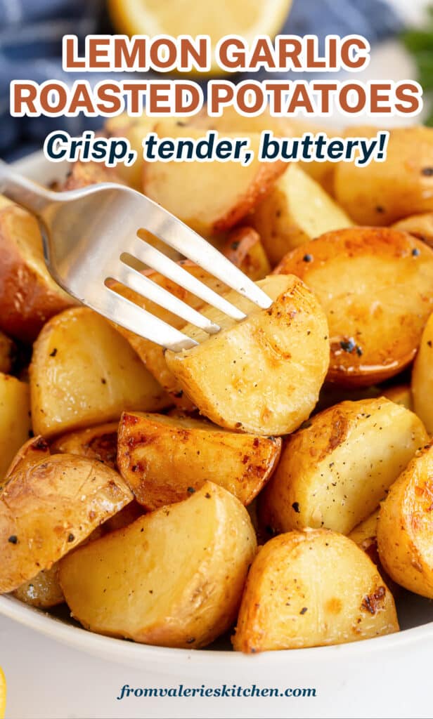 A bowl filled with roasted potatoes with a fork piercing one on top with text.