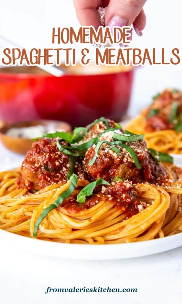 A dinner plate filled with homemade spaghetti and meatballs topped with basil and Parmesan with text.