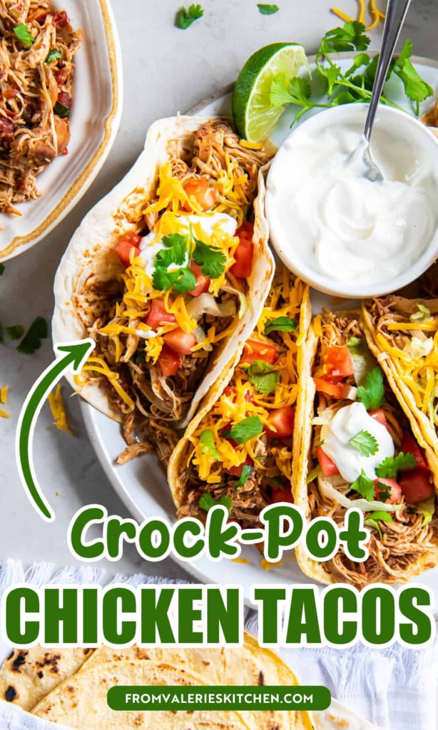 Shredded chicken tacos on a platter with a bowl of sour cream with text overlay.