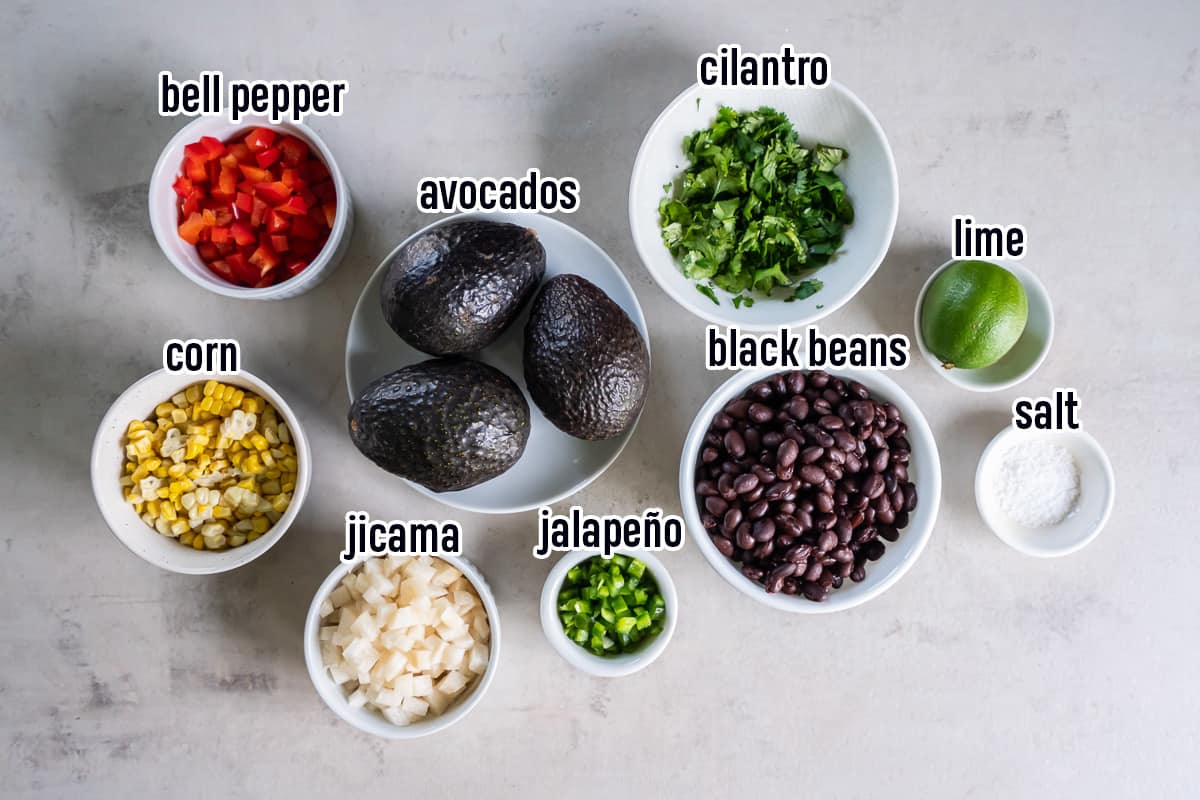 Avocados, diced red peppers, black beans, chopped jicama and other ingredients in bowls with text.