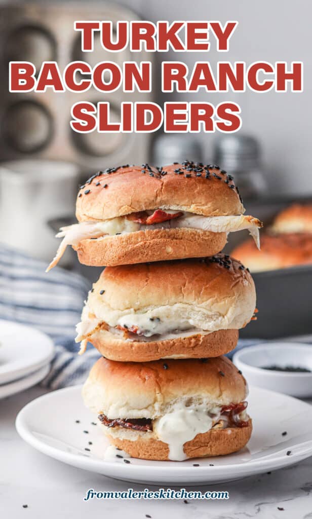 A stack of three Turkey Bacon Ranch Sliders on a white plate with text.