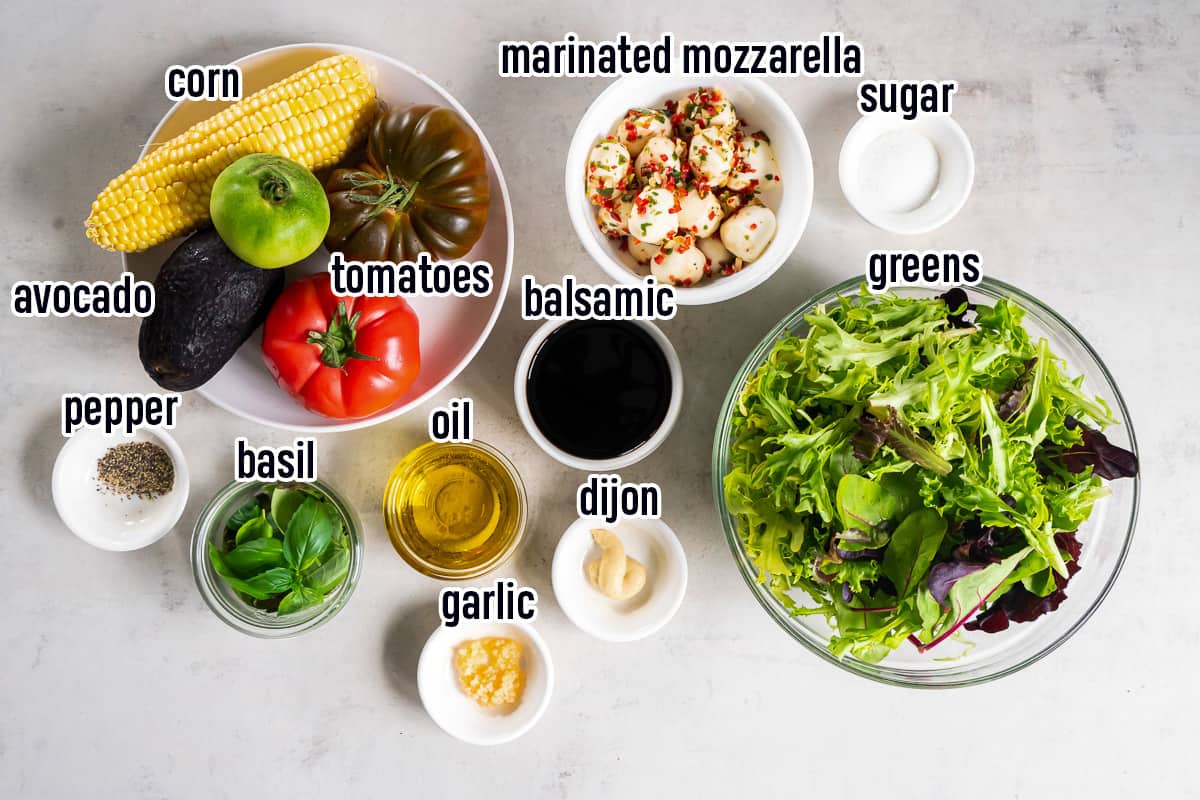 Heirloom tomatoes, sweet corn, salad greens and other ingredients in bowls with text.
