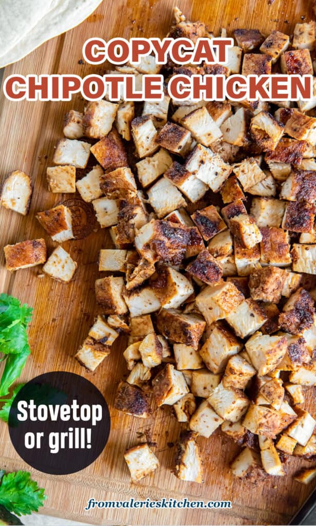 A top down shot of chopped copycat Chipotle Chicken on a cutting board with text.